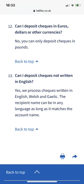 How can I pay in a US dollar cheque in the UK?
