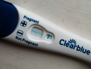 Stomach growing,  one faint positive test, lots of negatives? 