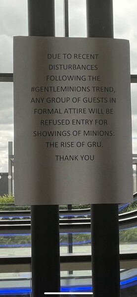 Cinema stopping kids in suits from coming in - Minions