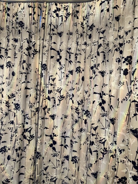 Navy sofa, light sage walls