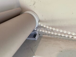 How do I remove this roller blind? (Pics!)