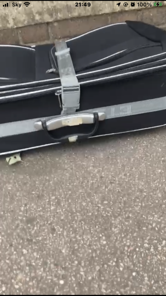 AIBU to be curious about abandoned suitcase across road?