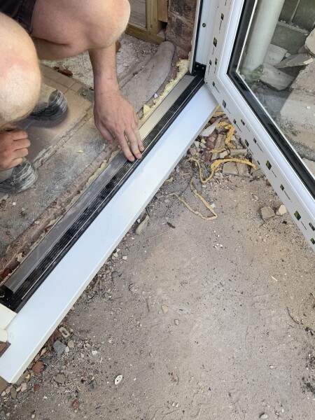 Bouncy strip on bottom of new door- is that normal?