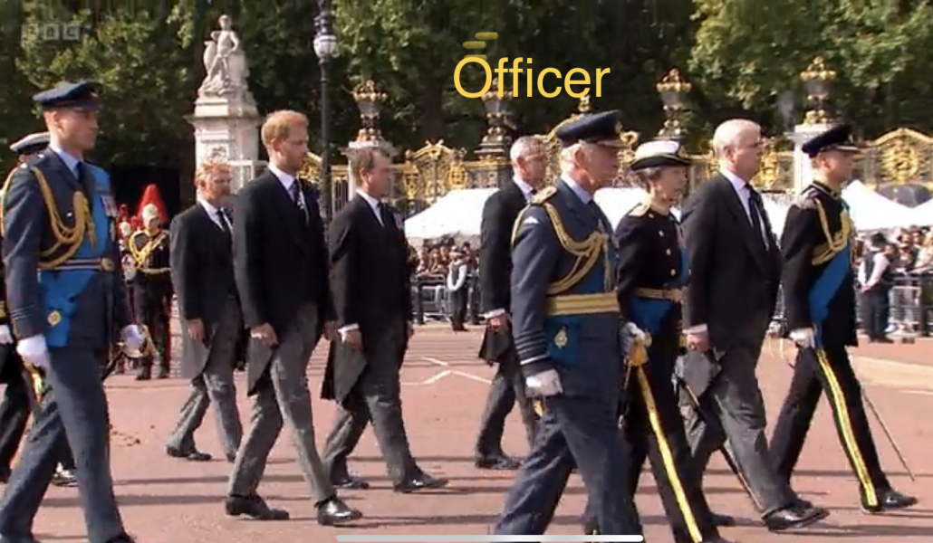 Who is behind the coffin