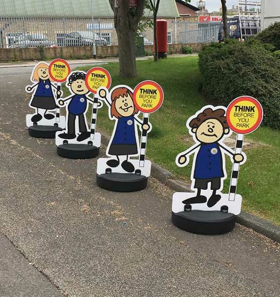 To stand on road to stop parents parking illegally