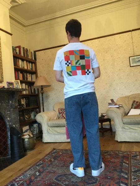How should student son wag this t-shirt without losing the white/colours running?