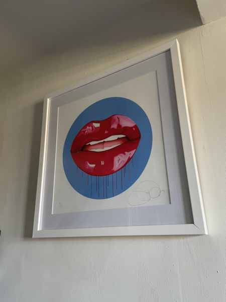 What do you have on the wall above your bed?