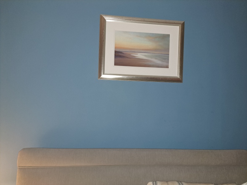 What do you have on the wall above your bed?