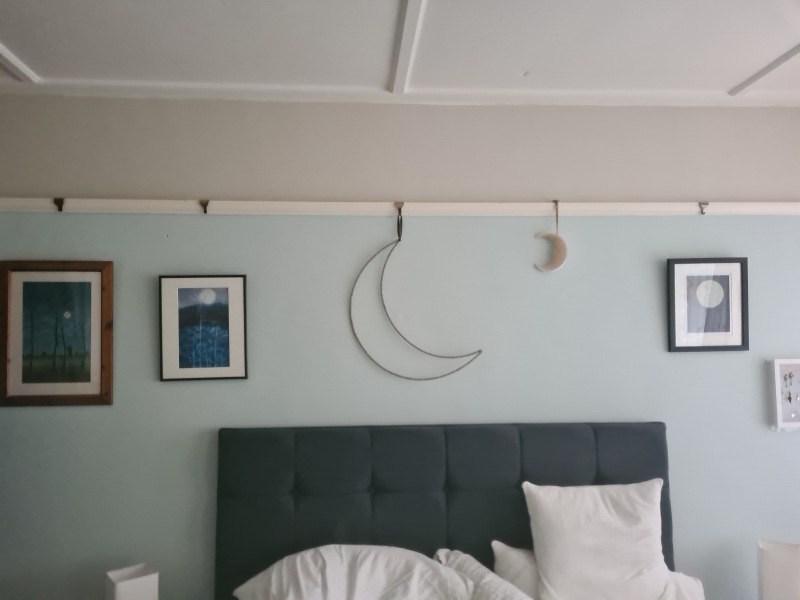 What do you have on the wall above your bed?