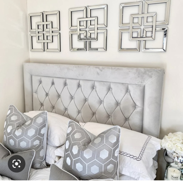 What do you have on the wall above your bed?