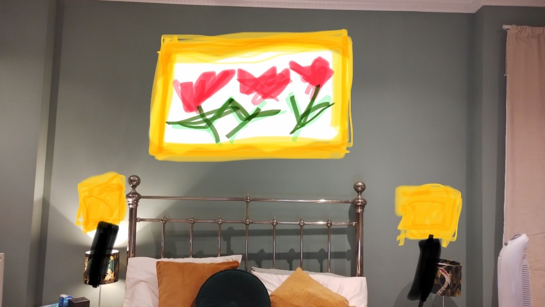 What do you have on the wall above your bed?