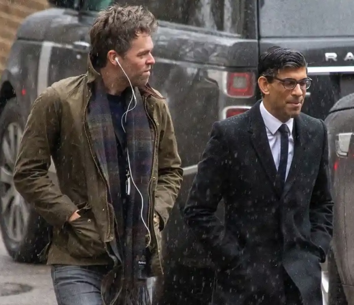 Who was that woman with Rishi Sunak just now at the palace?!
