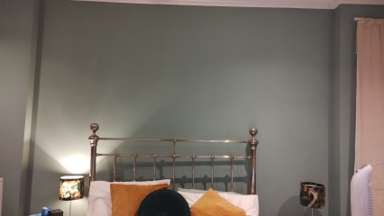 What do you have on the wall above your bed?
