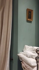 What do you have on the wall above your bed?