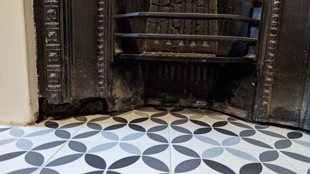How to minimise this gap in the fireplace surround?