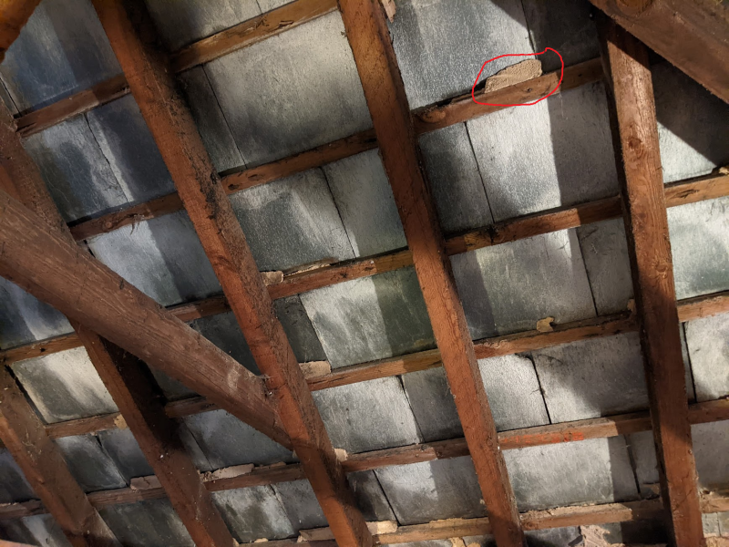 Mortar? coming loose under slate roof on garage