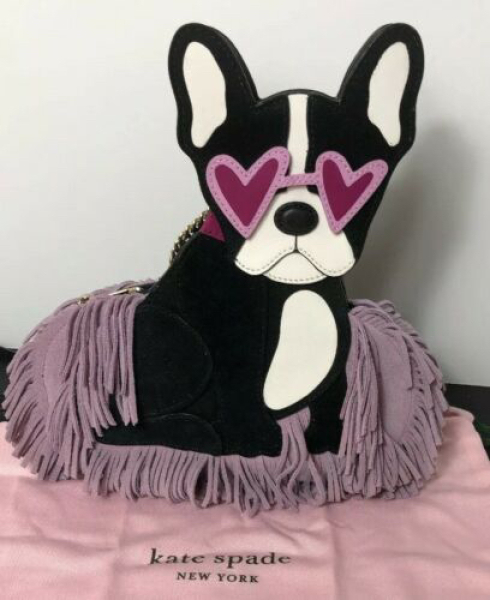 To have splurged on a novelty Kate spade bag....