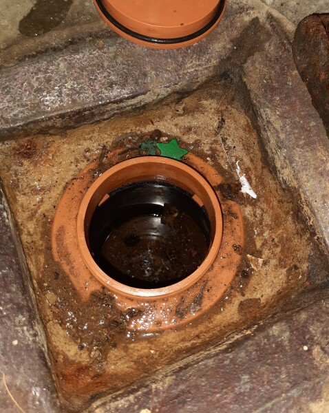 Drainage pipe in basement overflowing. Help!