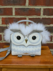 To have splurged on a novelty Kate spade bag....