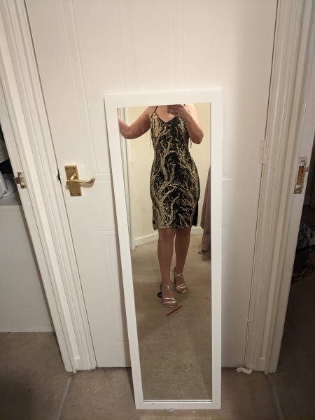 Wearing an unflattering outfit to a party 