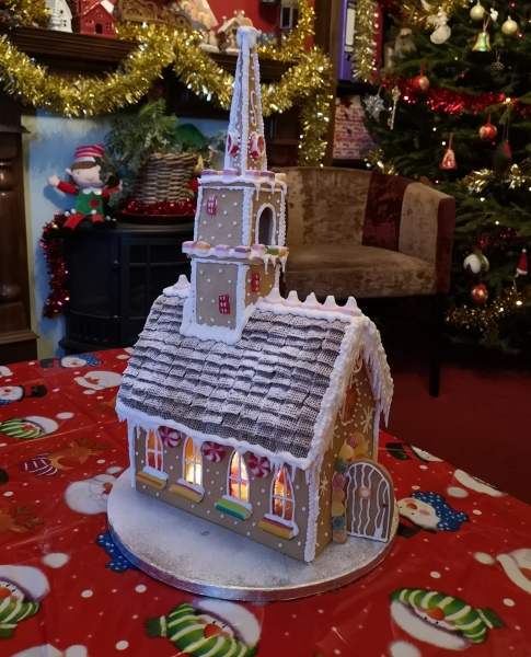 Anyone want to share gingerbread house pics? 