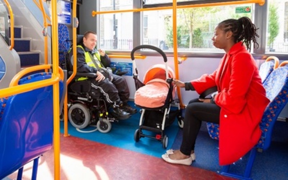 Taking the buggy off of the bus for a wheelchair