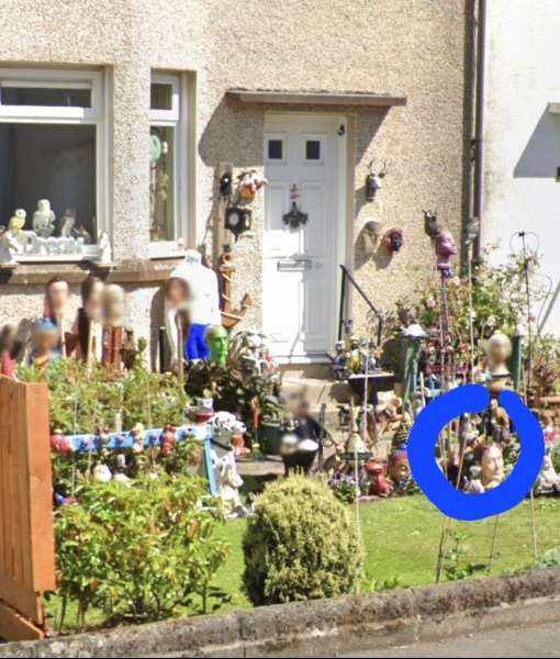 Weird dolls hanging on neighbours tree?