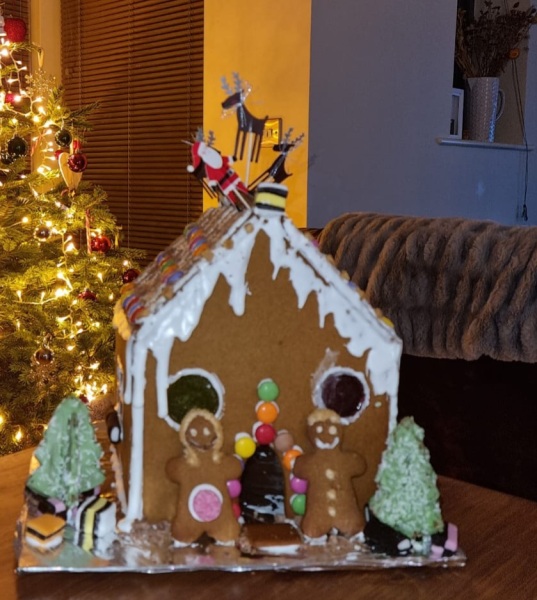 Anyone want to share gingerbread house pics? 