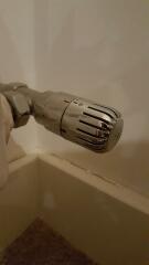 Why are two of my radiators boiling hot despite the thermostatic controls being turned to '0'?