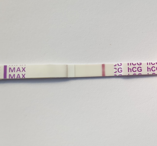 12 dpo. Anyone see a v faint line please?!