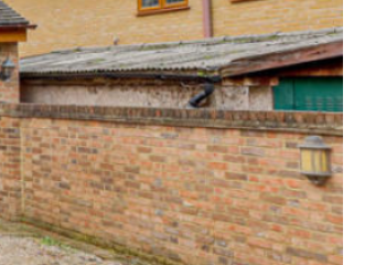 House next to garage/shed sized electrical substation???