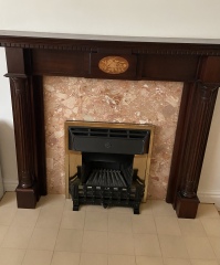How can I make this ugly fireplace look better?