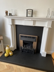 How can I make this ugly fireplace look better?
