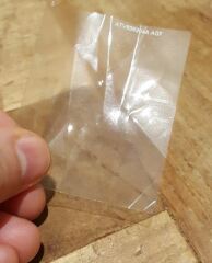 There appears to be a square of loose plastic or paper inside my coat lining, shall I unpick the stitches to investigate?