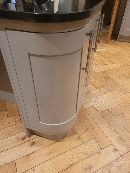 What colour armchair  in this kitchen?