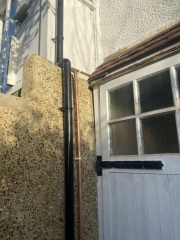 New gas meter outside with ugly pipes
