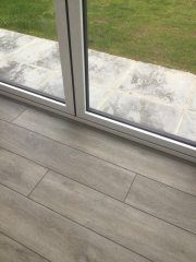 Porcelain tiles or luxury vinyl in sunny room?