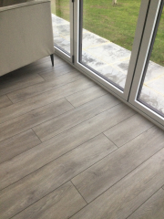 Porcelain tiles or luxury vinyl in sunny room?