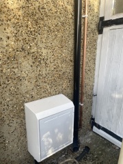 New gas meter outside with ugly pipes