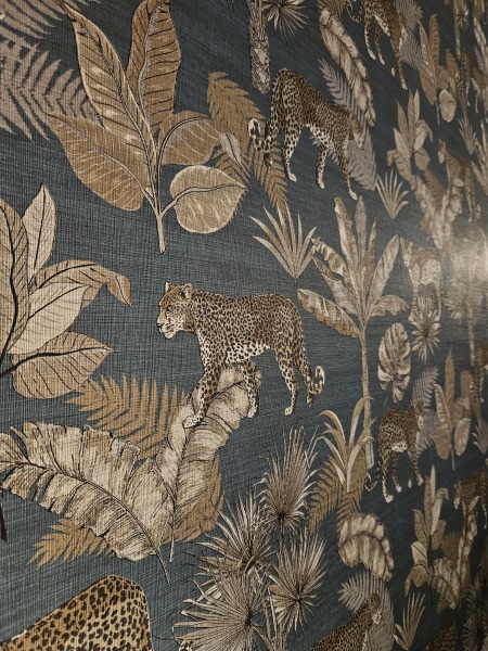 Teal paint & quirky wallpaper for living room 