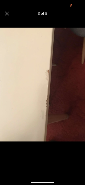 Touching up a chipped gloss table.