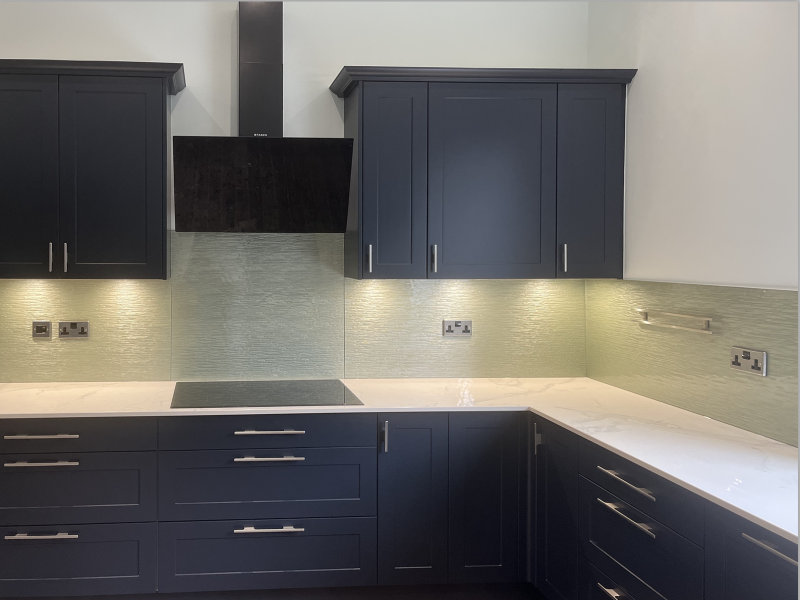 Clear glass splashback over tiles?