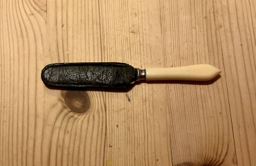 We inherited a tiny butter knife with its own sheath
