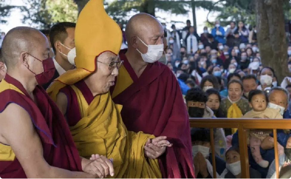 Dalai llama ask a child to suck his tongue