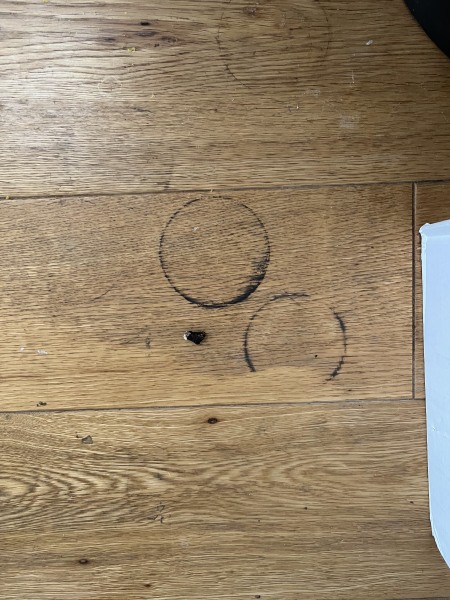 How to remove black greasy stains from laminate wooden flooring