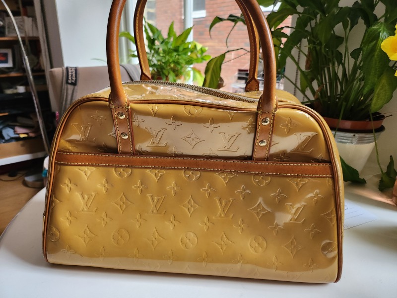 Why do people buy designer bags/shoes?