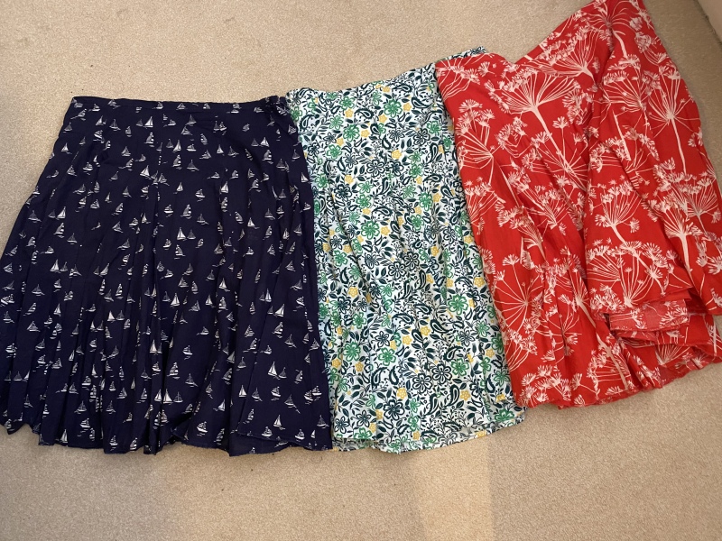 What tops with these skirts? 