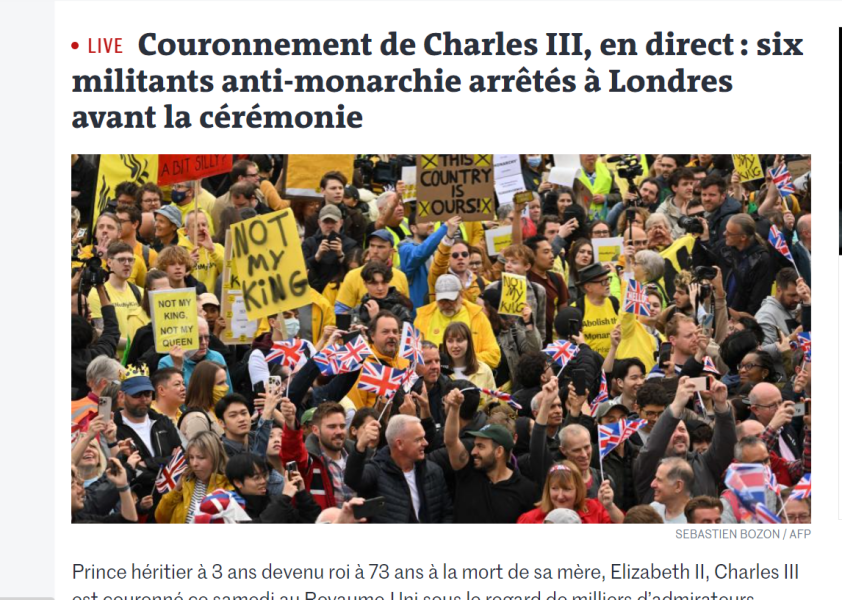Arrested for holding a banner - can't ruin a big day, can we...