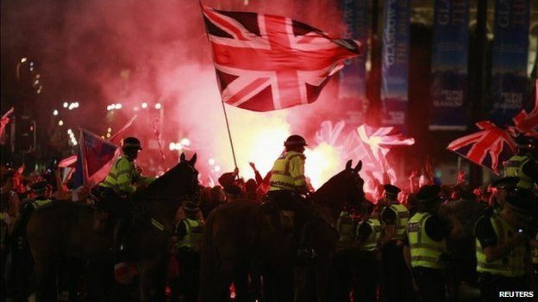 Arrested for holding a banner - can't ruin a big day, can we...