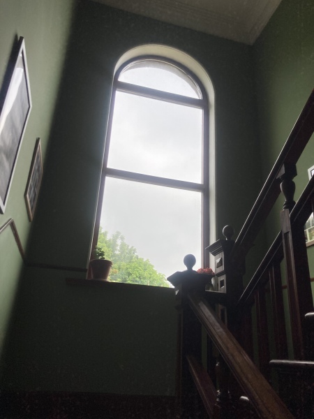 How to clean inside of tall landing window